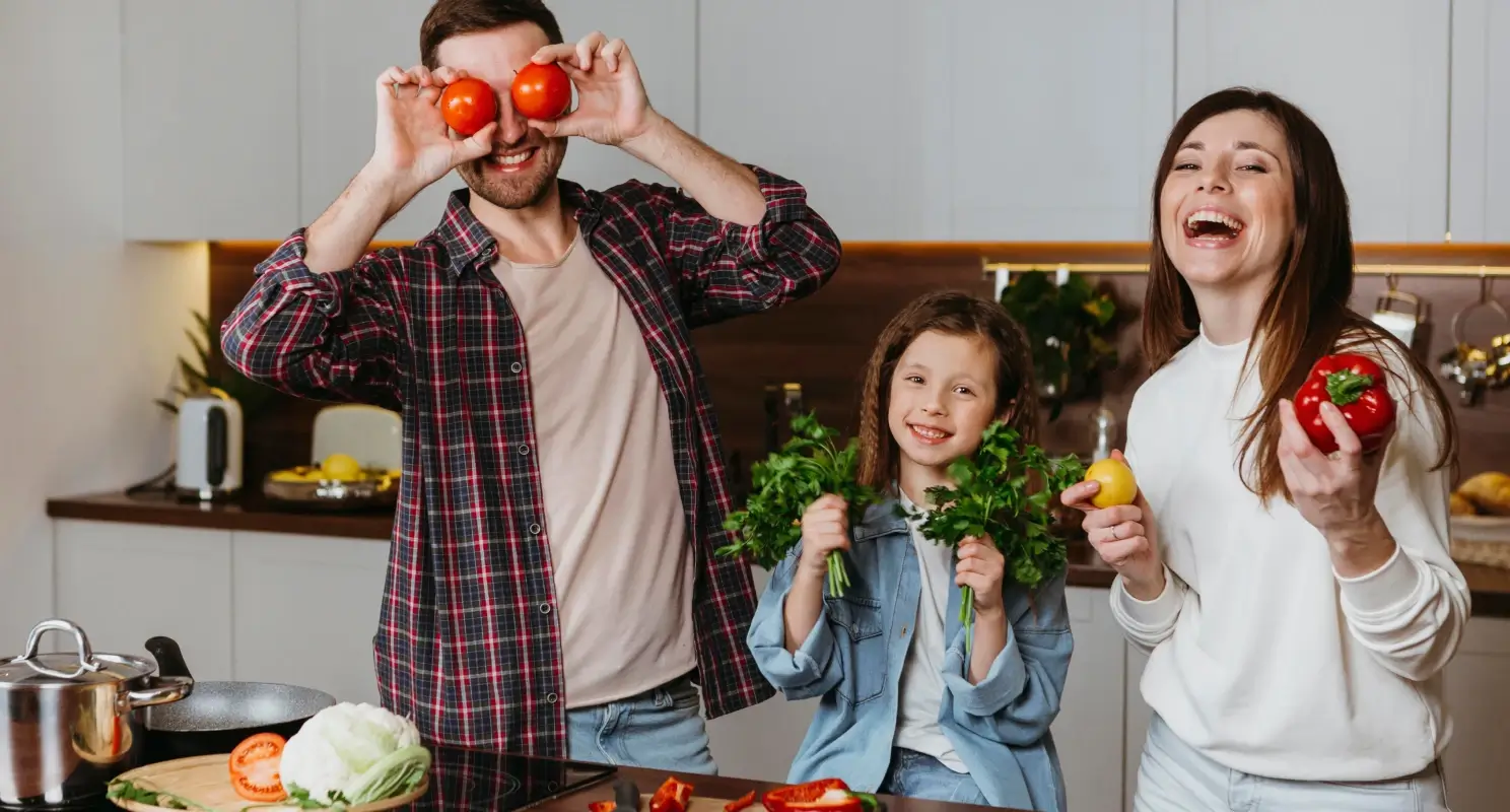 Family having fun preparing food in the kitchen